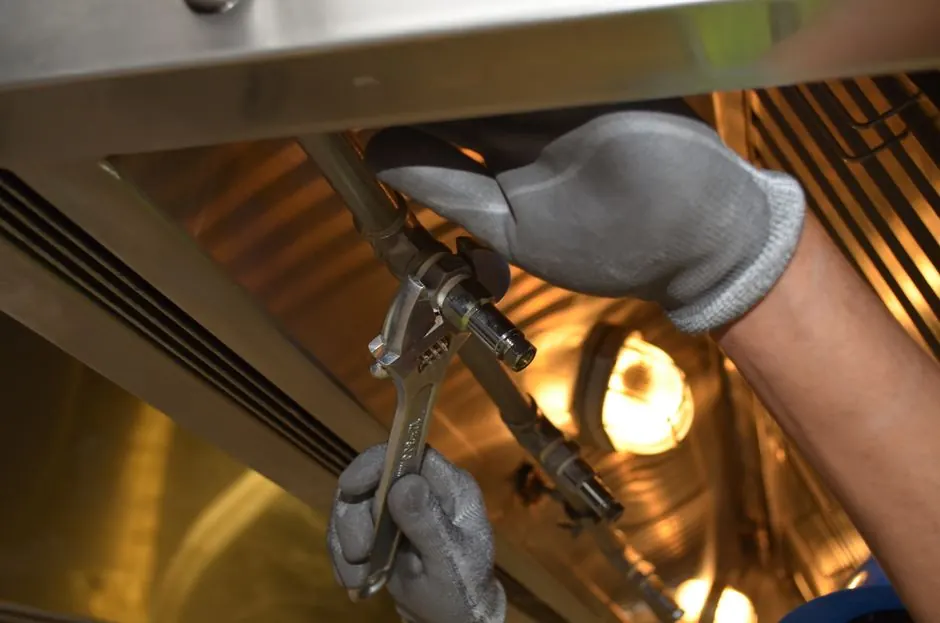 Technician using tools during a service visit